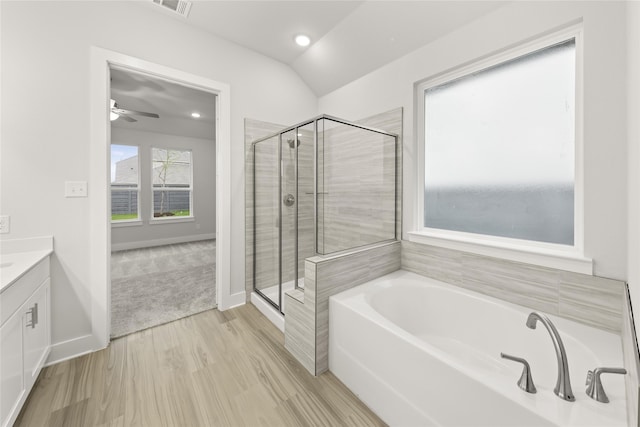 bathroom with independent shower and bath, wood-type flooring, vanity, and ceiling fan