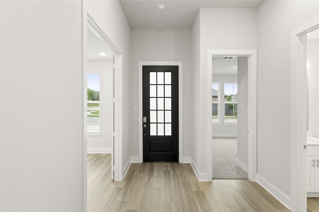 view of carpeted entrance foyer