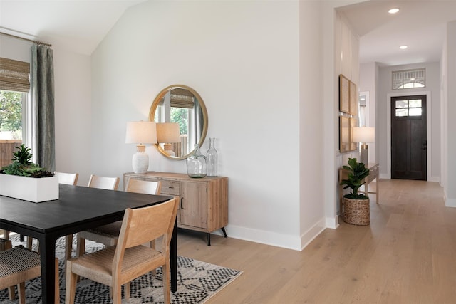 dining room featuring a wealth of natural light and light wood-type flooring