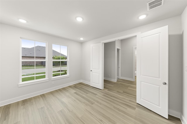 unfurnished bedroom featuring light hardwood / wood-style flooring