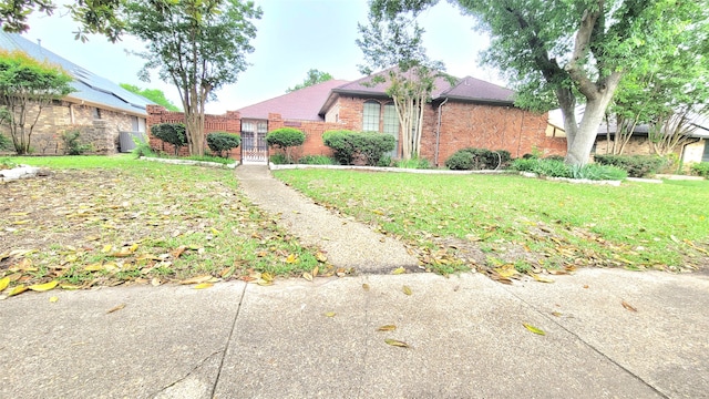 single story home featuring a front yard