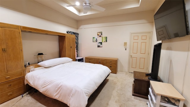 bedroom with light colored carpet and ceiling fan