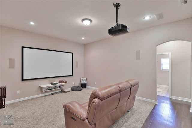 cinema featuring hardwood / wood-style flooring