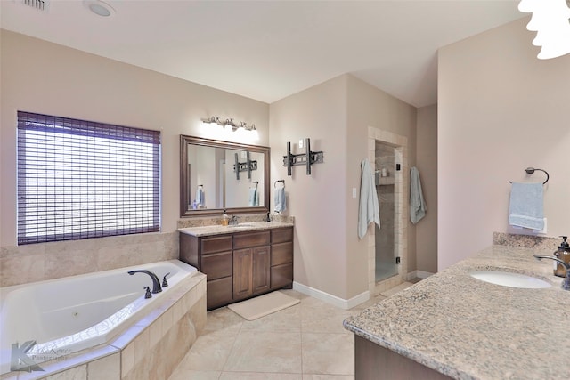 bathroom featuring large vanity, tile floors, and separate shower and tub