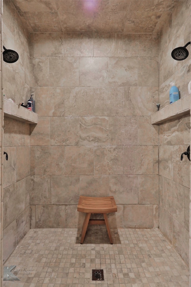 bathroom with tiled shower