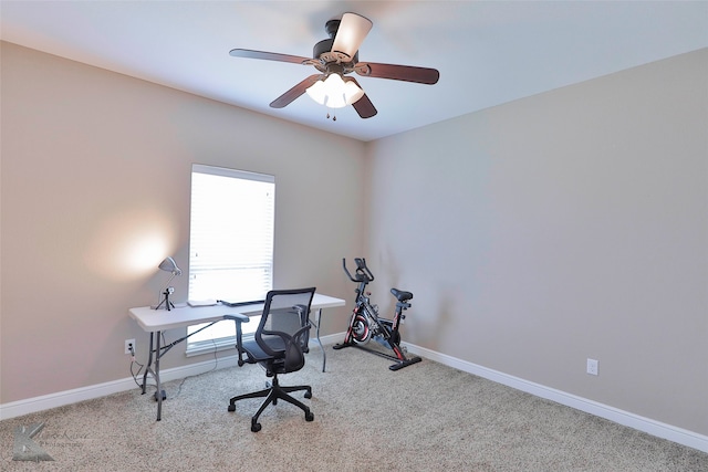 carpeted home office with ceiling fan