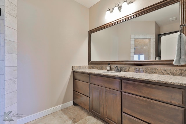 bathroom with vanity and tile floors