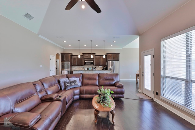 living room with wood-type flooring, ceiling fan, and crown molding