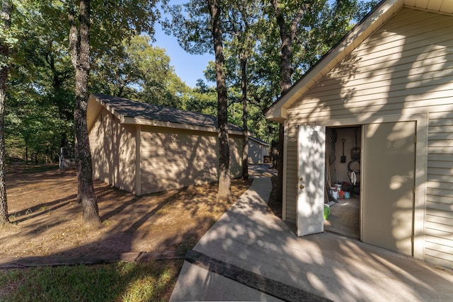 view of side of property with a shed