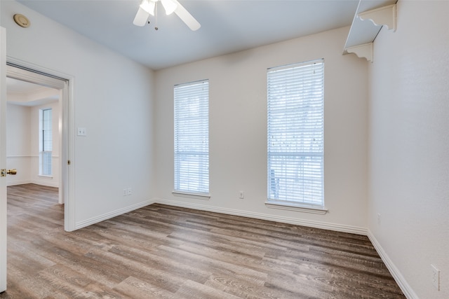 empty room featuring light hardwood / wood-style floors and ceiling fan