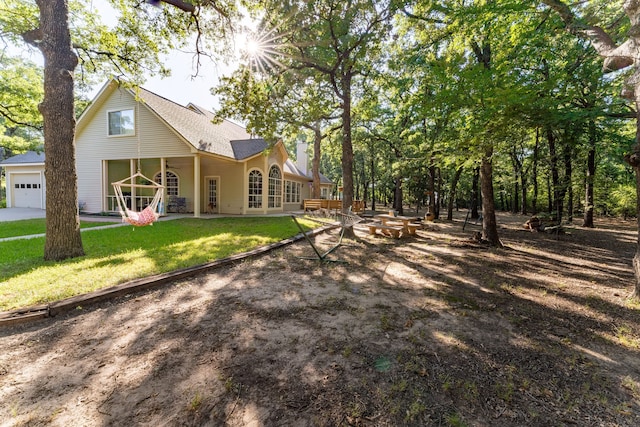 rear view of house with a yard