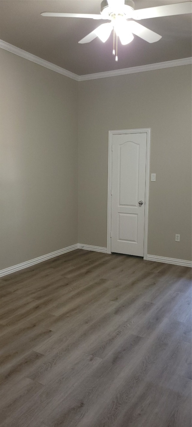 spare room featuring ornamental molding, wood-type flooring, and ceiling fan