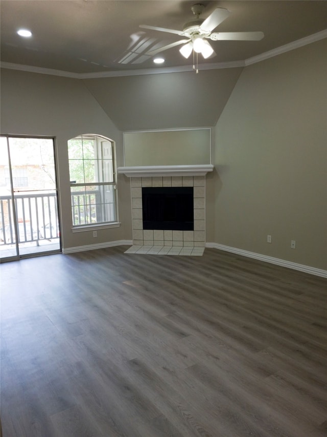 unfurnished living room featuring dark hardwood / wood-style flooring, ceiling fan, crown molding, and a tile fireplace