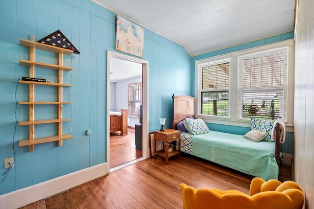 bedroom with hardwood / wood-style flooring