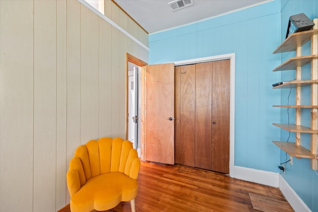 living area featuring hardwood / wood-style floors