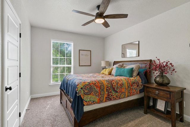 bedroom with carpet, multiple windows, and ceiling fan