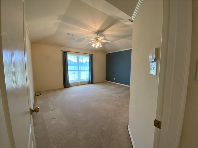 carpeted spare room with ceiling fan and lofted ceiling