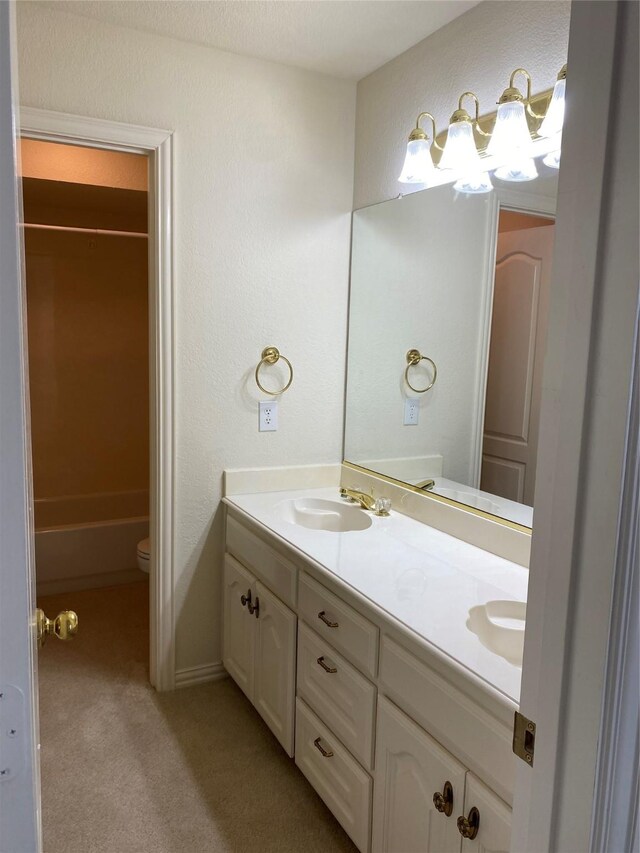 full bathroom featuring shower / washtub combination, toilet, and double sink vanity