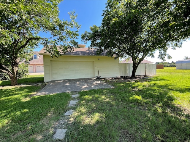 view of property exterior with a garage and a yard