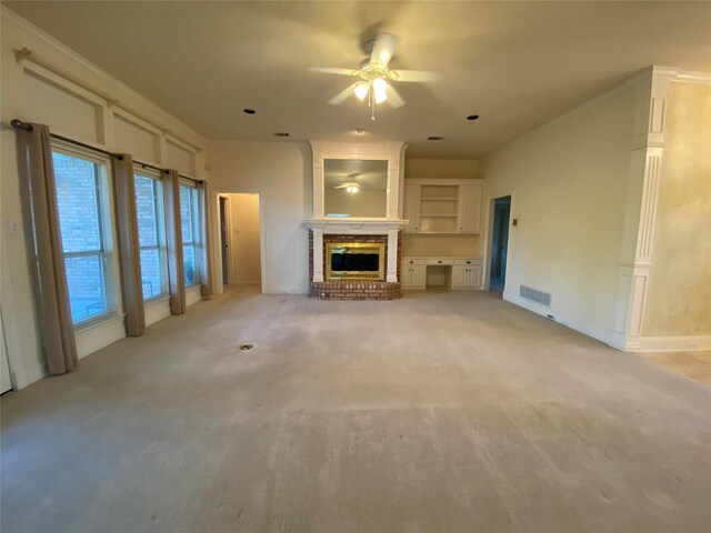 unfurnished living room featuring ceiling fan, light carpet, and a brick fireplace