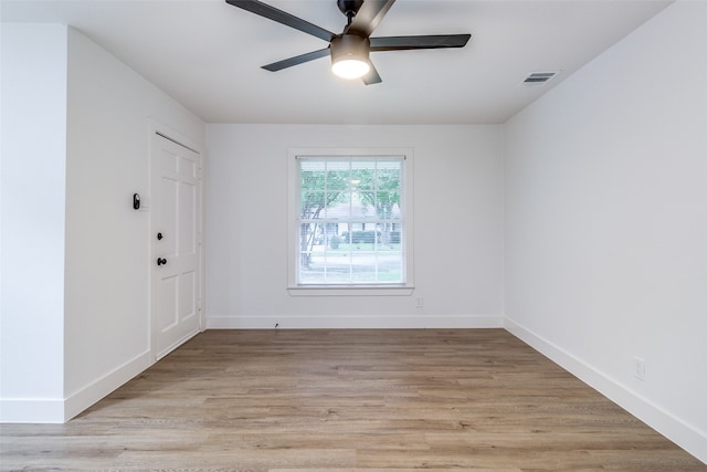 unfurnished room featuring ceiling fan and light wood-type flooring