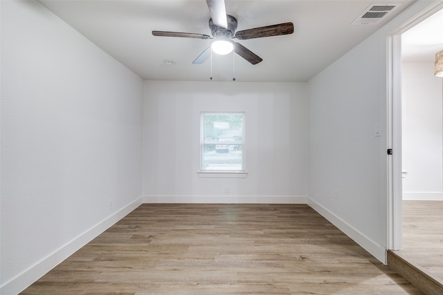 spare room featuring ceiling fan and light wood-type flooring