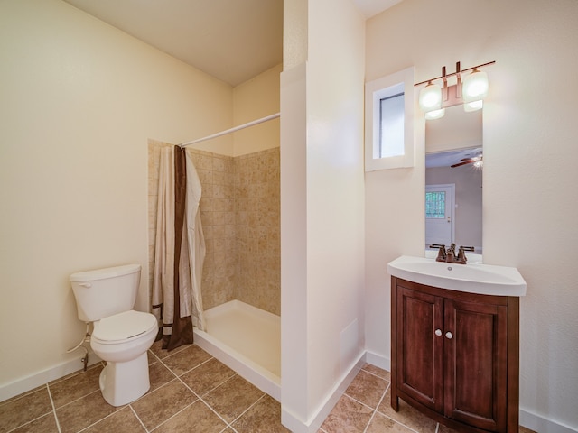 bathroom with ceiling fan, toilet, a shower with shower curtain, tile flooring, and vanity