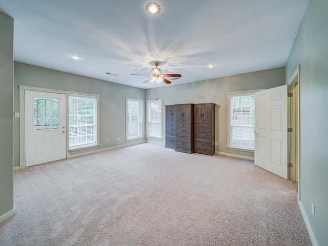 unfurnished bedroom with carpet, ceiling fan, and access to outside