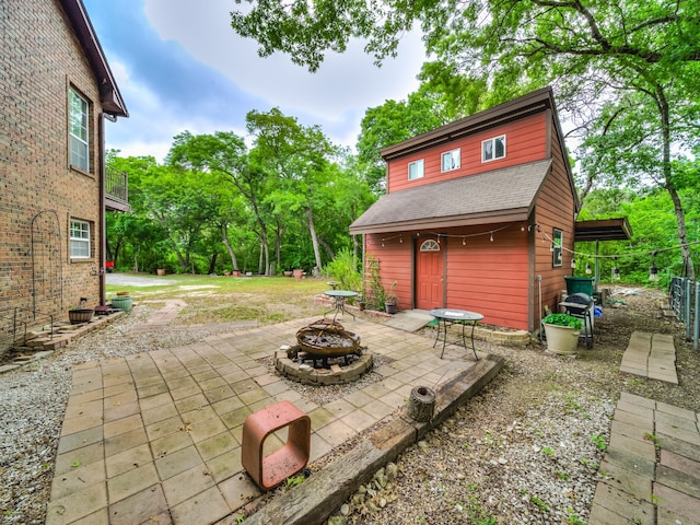 view of patio / terrace featuring a fire pit