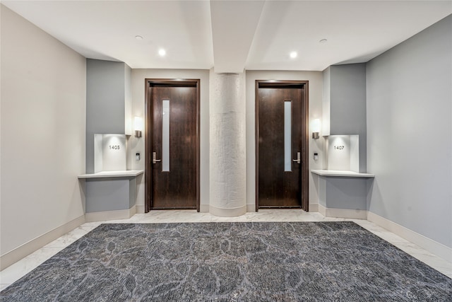 bathroom featuring elevator and tile flooring