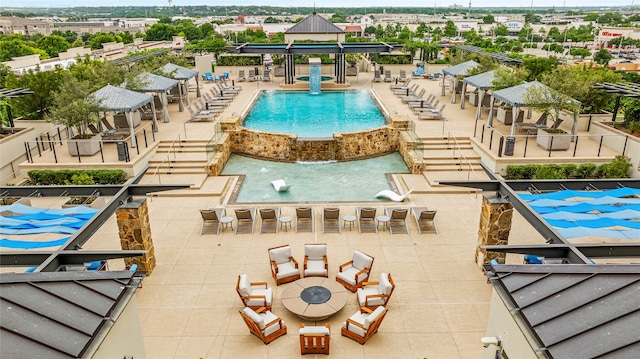 view of swimming pool with a patio area, a gazebo, and exterior bar