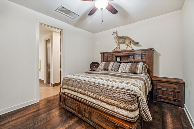 bedroom featuring tile floors and ceiling fan