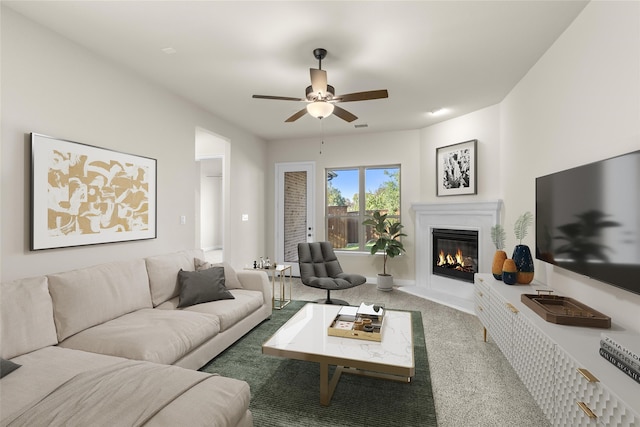 carpeted living room with ceiling fan