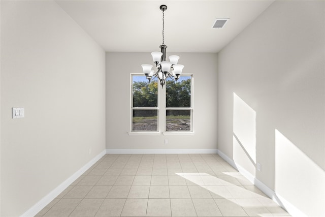 unfurnished dining area featuring a notable chandelier and light tile patterned flooring