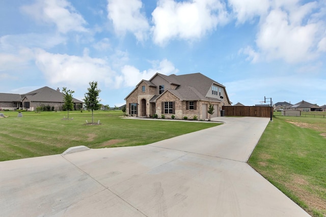 french provincial home with a front yard