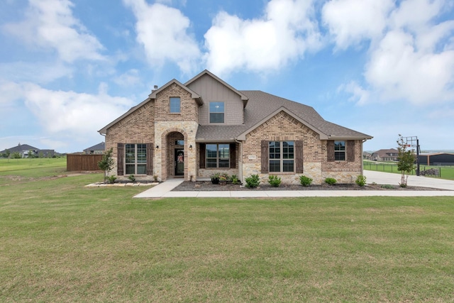 craftsman inspired home with a front lawn