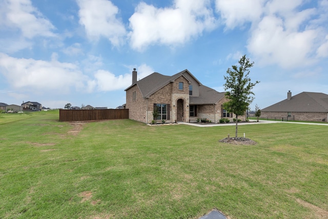 view of front of home with a front yard