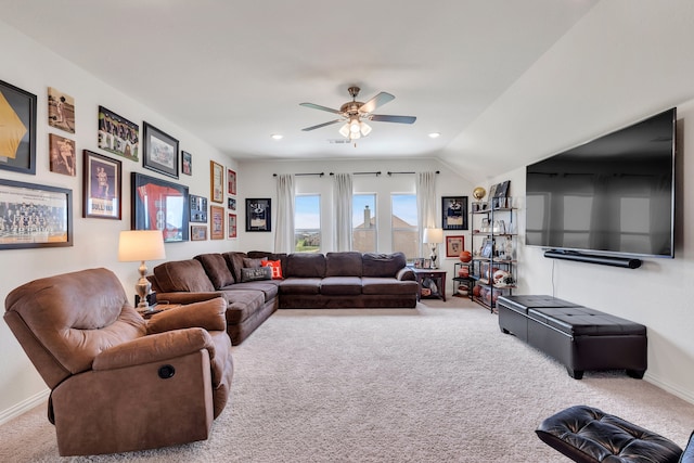 living room featuring carpet flooring, ceiling fan, and vaulted ceiling