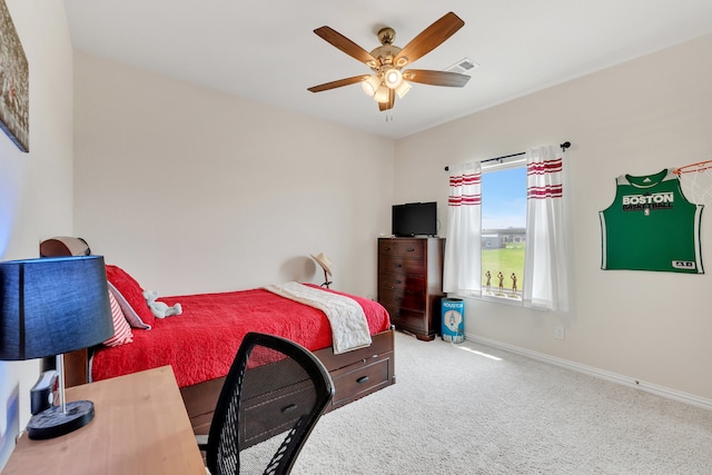 bedroom with ceiling fan and light colored carpet