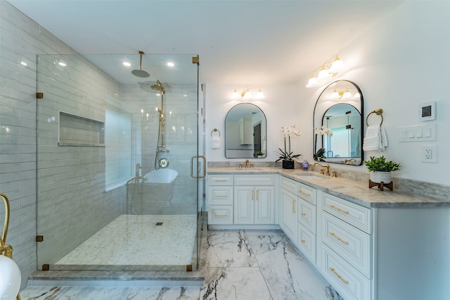 bathroom featuring walk in shower, vanity, and tile flooring