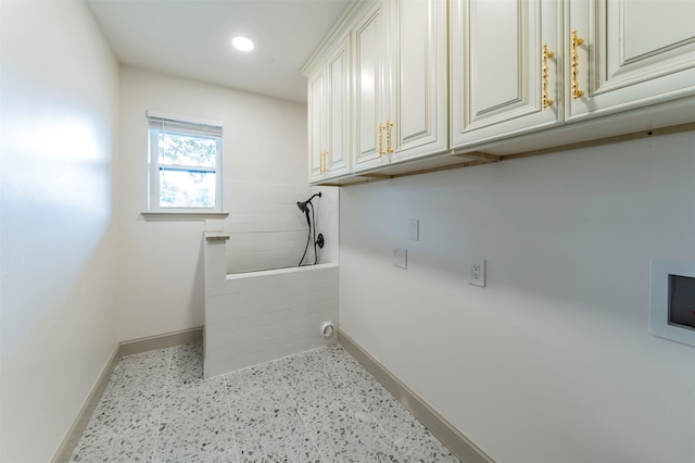 laundry room with hookup for an electric dryer, cabinets, and hookup for a washing machine