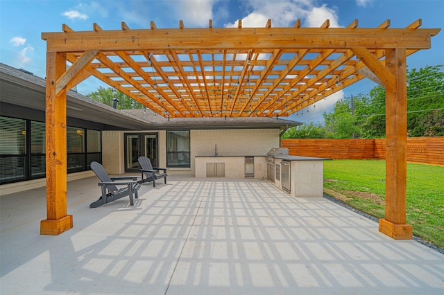 view of patio with area for grilling, a pergola, and grilling area