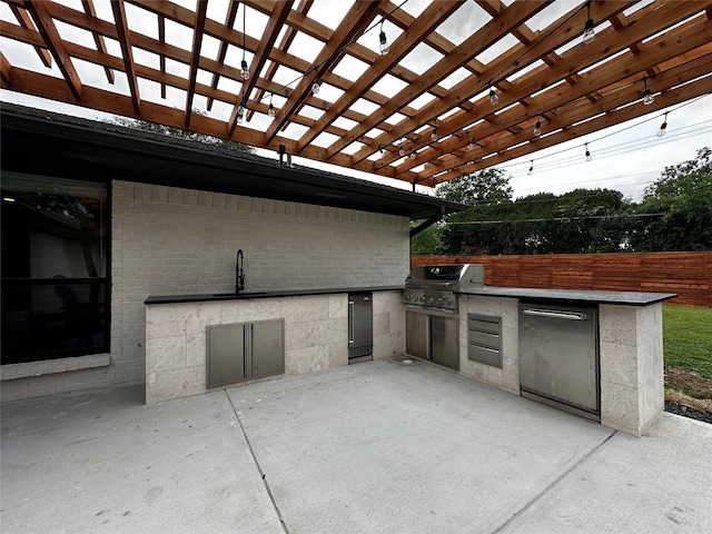 view of patio / terrace featuring area for grilling, a pergola, a grill, and sink