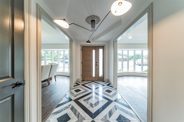 entrance foyer with a healthy amount of sunlight and tile floors