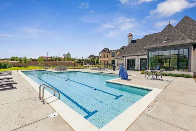 view of swimming pool with a patio