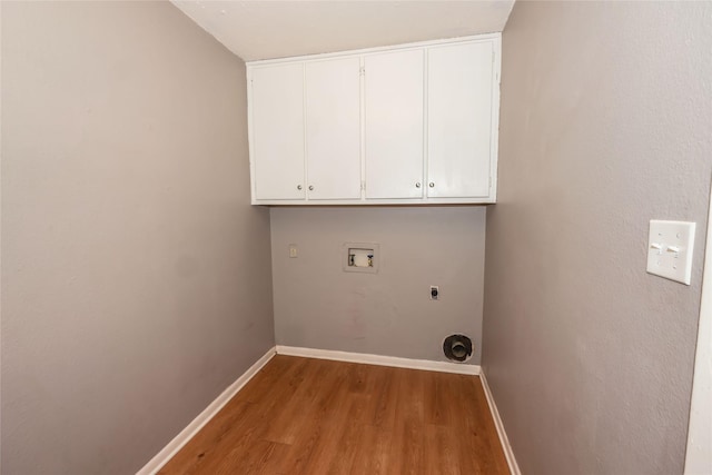 laundry room featuring baseboards, washer hookup, cabinet space, and electric dryer hookup