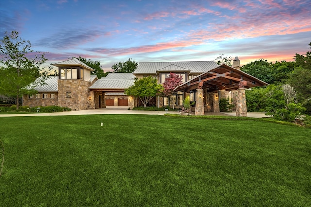 exterior space with a lawn and concrete driveway