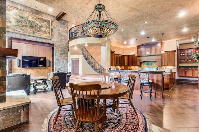 dining room with stairs and recessed lighting