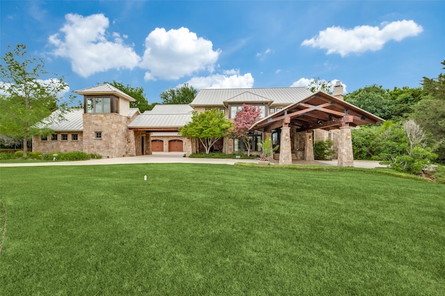 view of front of home with metal roof, stone siding, a front lawn, and a standing seam roof