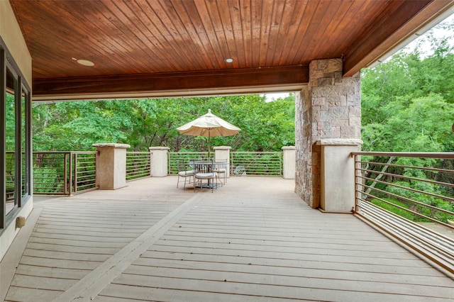 wooden deck featuring outdoor dining area